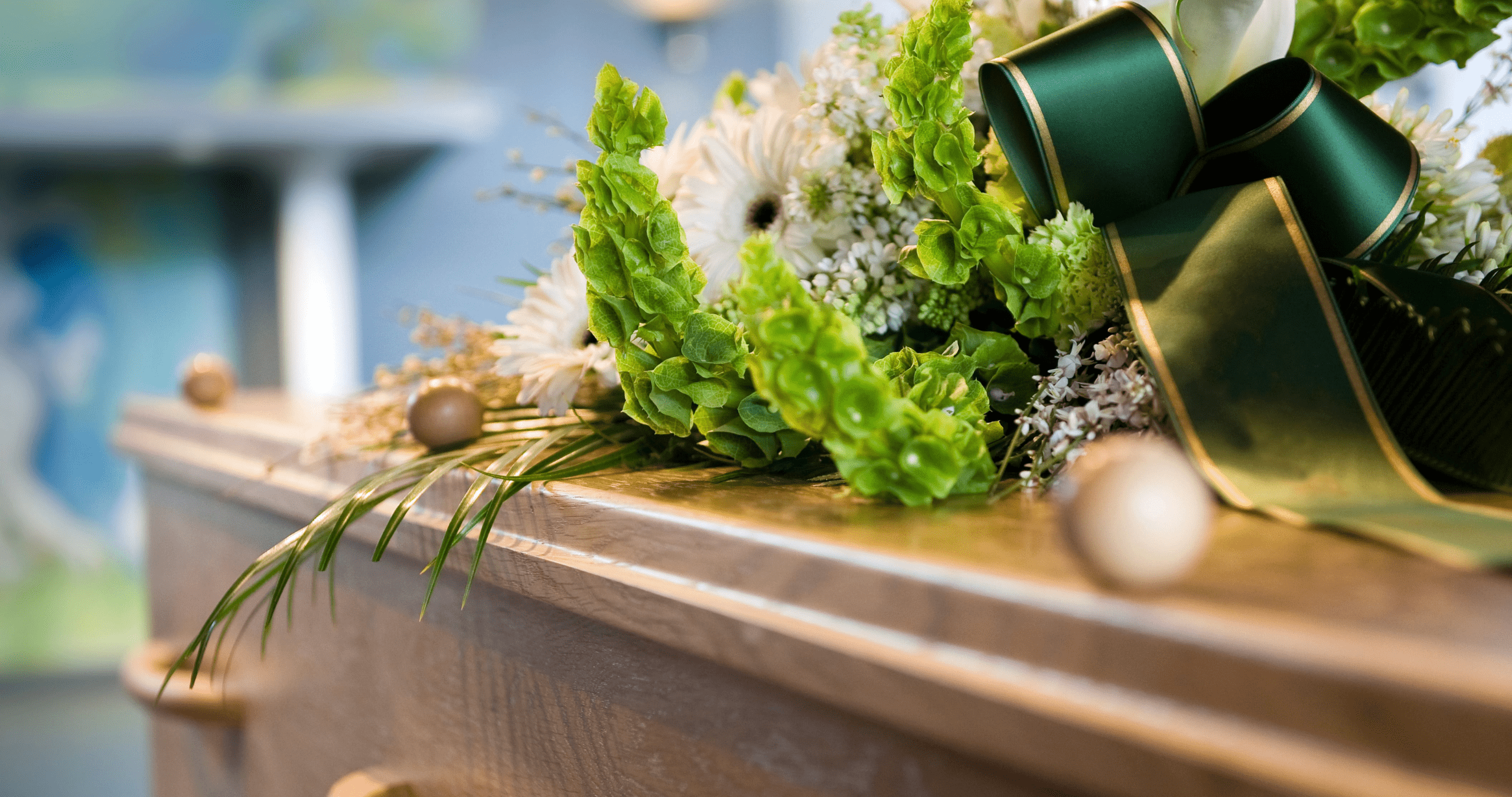 coffin with flowers on top